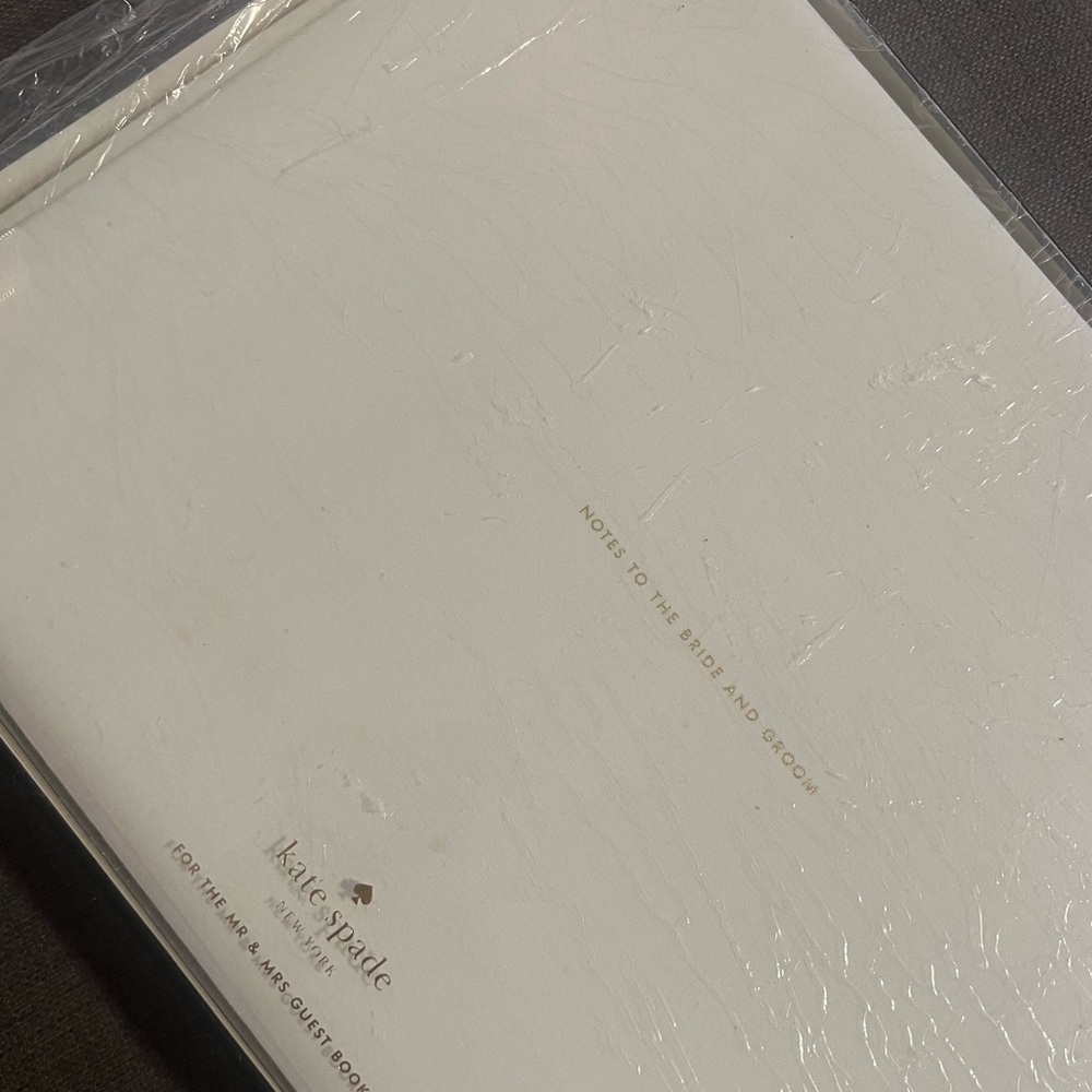 Kate Spade wedding guestbook. New but slightly stained on the front cover.
